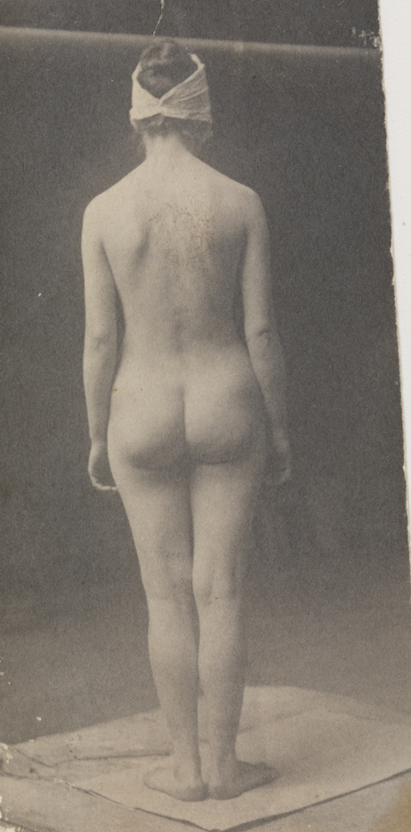 Female nude with mask, from rear