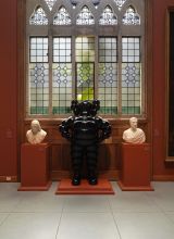 CHUM, 2009. Painted fiberglass, 90 x 54 x 30 in. Flanked by Horatio Greenough's Marquis de Layfayette, 1831 (right), and Giuseppe Iardella's Benjamin Franklin, ca. 1804 (right) in the Washington Foyer, Historic Landmark Building, Photo by Barbara Katus a