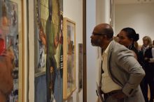 A visitor looks at a work during the ASE preview party.