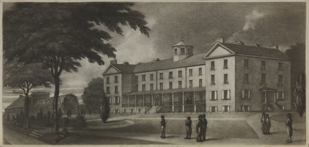 [Almshouse with arbor in background]