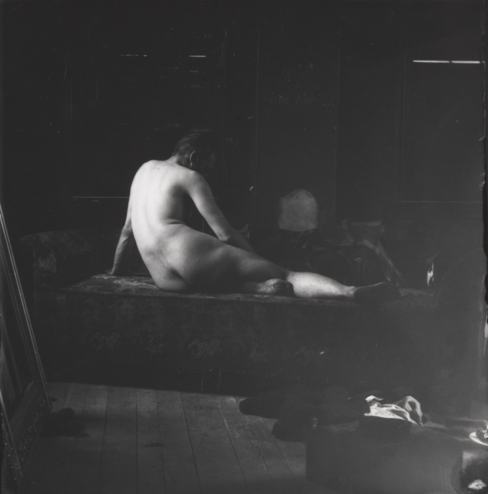 Thomas Eakins nude, semireclining on couch, from rear