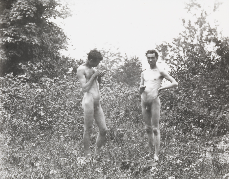 Male nude and J. Laurie Wallace in wooded landscape