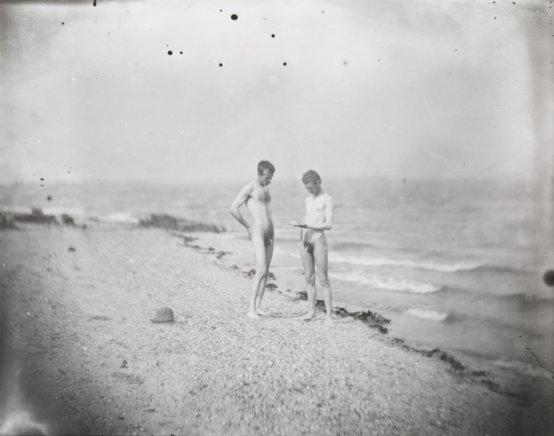 Male nude and J. Laurie Wallace nude at shoreline