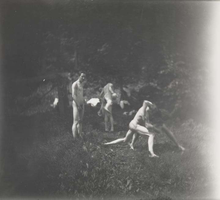 Six males, nude, four wrestling