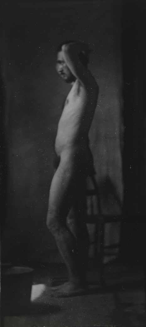 Naked series: Thomas Eakins with chair in front of cloth backdrop, pose 3