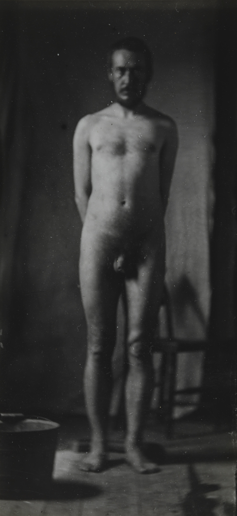 Naked series: Thomas Eakins with chair in front of cloth backdrop, pose 4