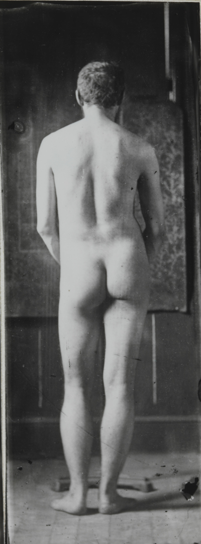 Naked series: Thomas Eakins on front of wallpaper backdrop, pose 7
