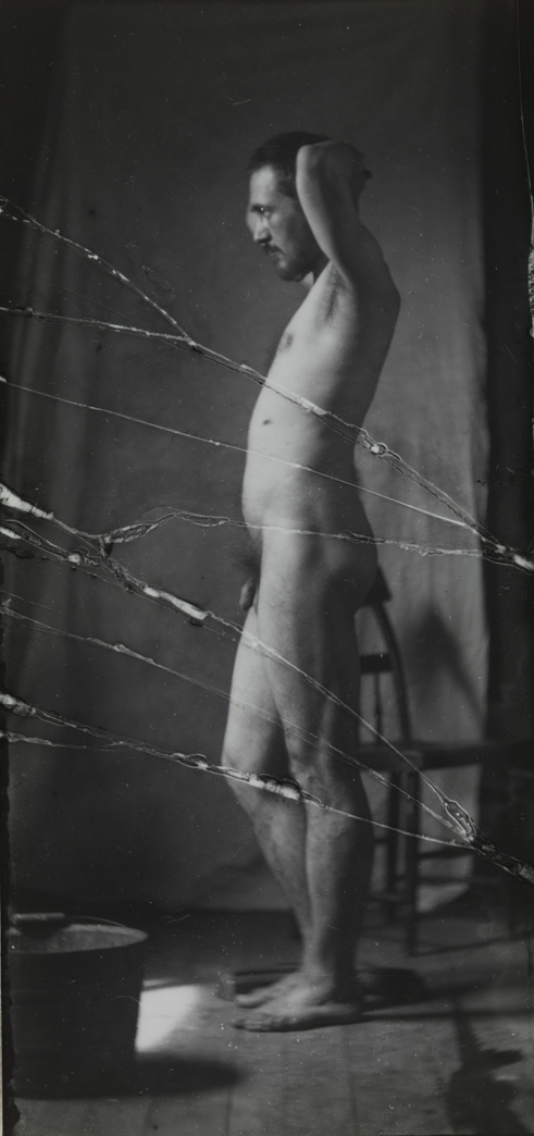 Naked series: Thomas Eakins with chair in front of cloth backdrop, pose 2