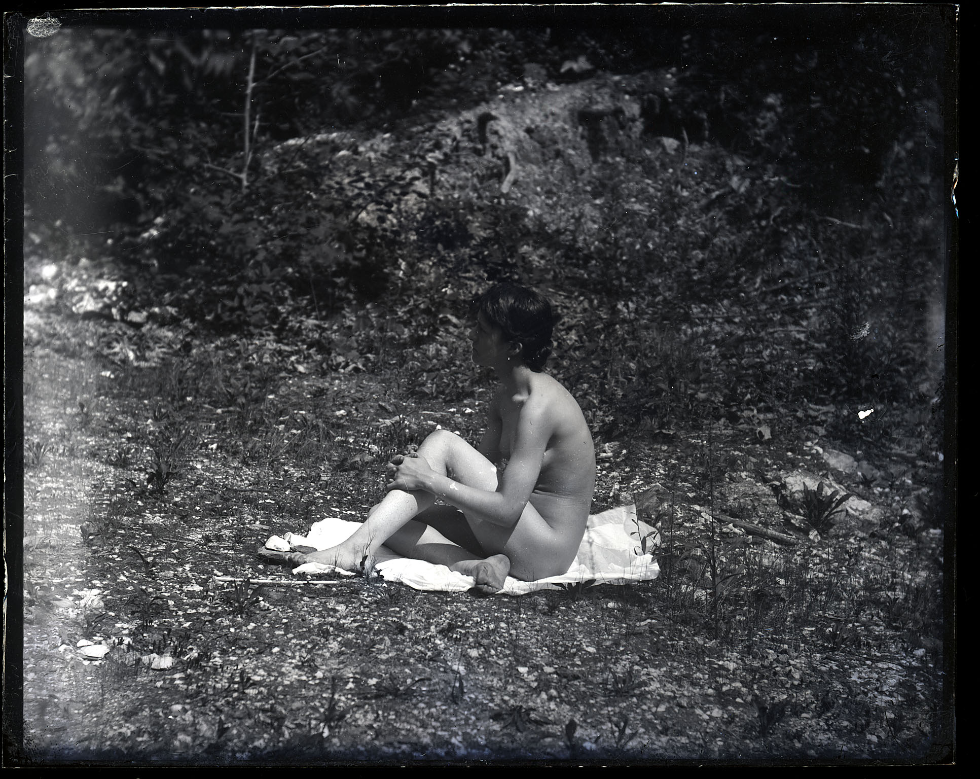Susan Macdowell Eakins nude, sitting, facing right, hands clasping right leg