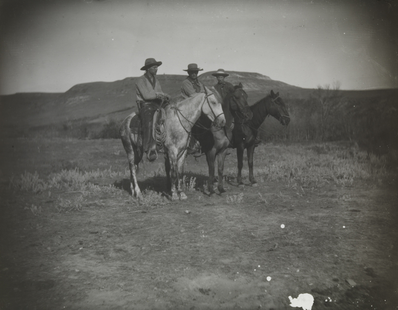 Three cowboys on horses