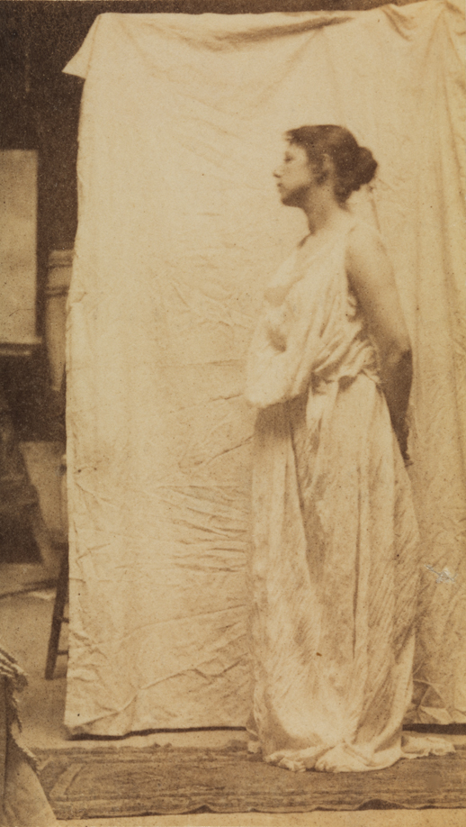 Weda Cook in classical costume, facing left