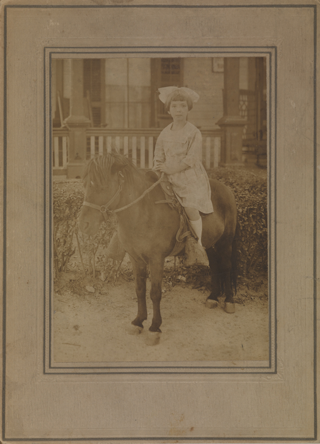 Unidentified girl on miniature pony