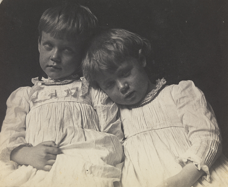Two children in light dresses