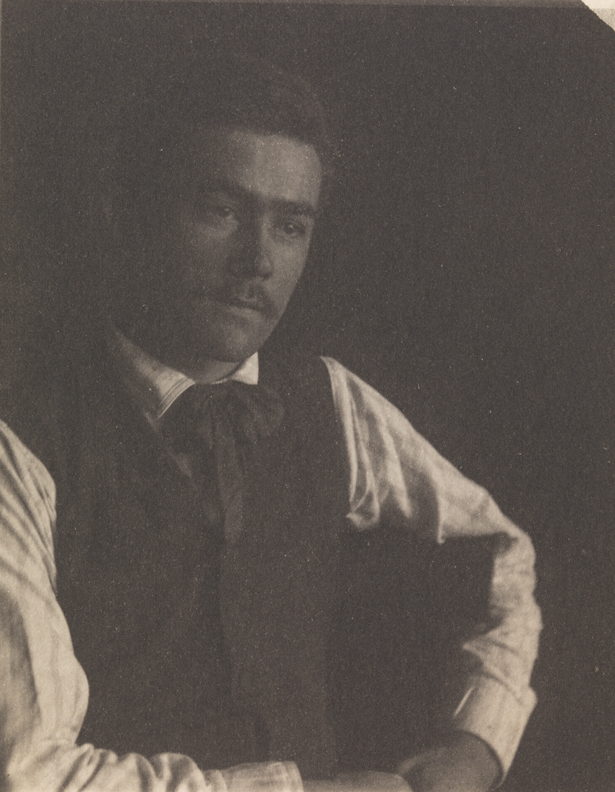 Samuel Murray sitting, looking right