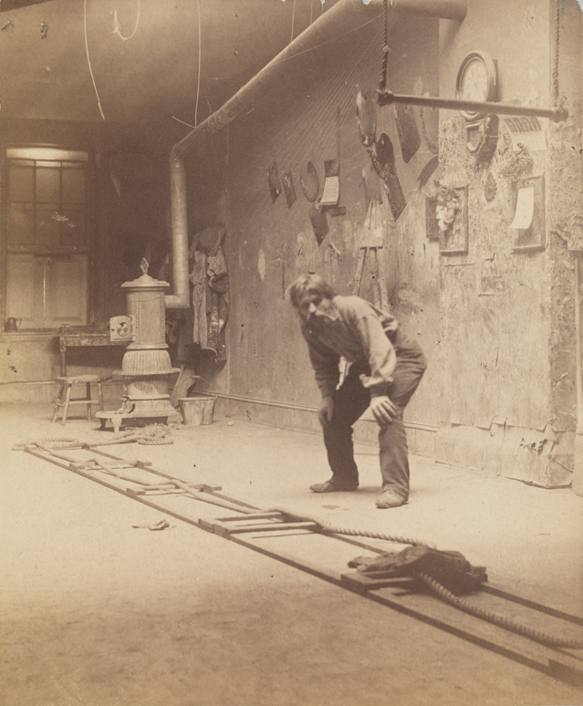 Franklin Schenck at Philadelphia Art Students' League, crouching, hands on knees