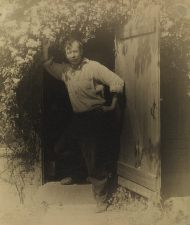 Charles Bregler in doorway of shed