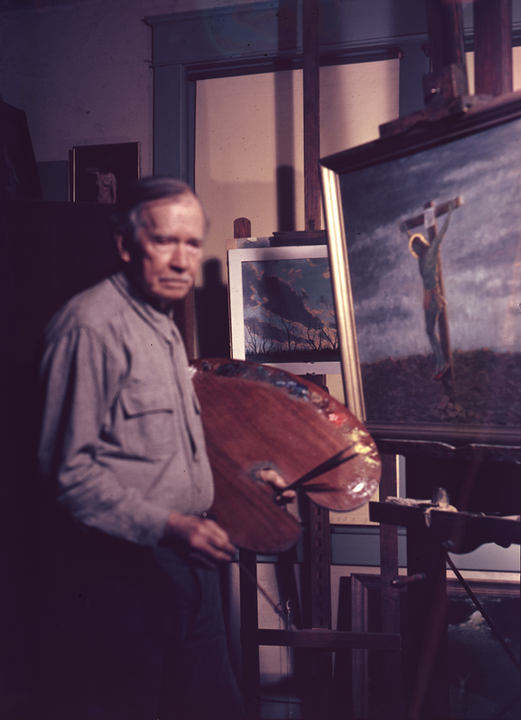 Charles Bregler with palette and paintings