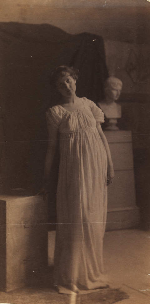 Woman in classical costume, with bust of Caesar