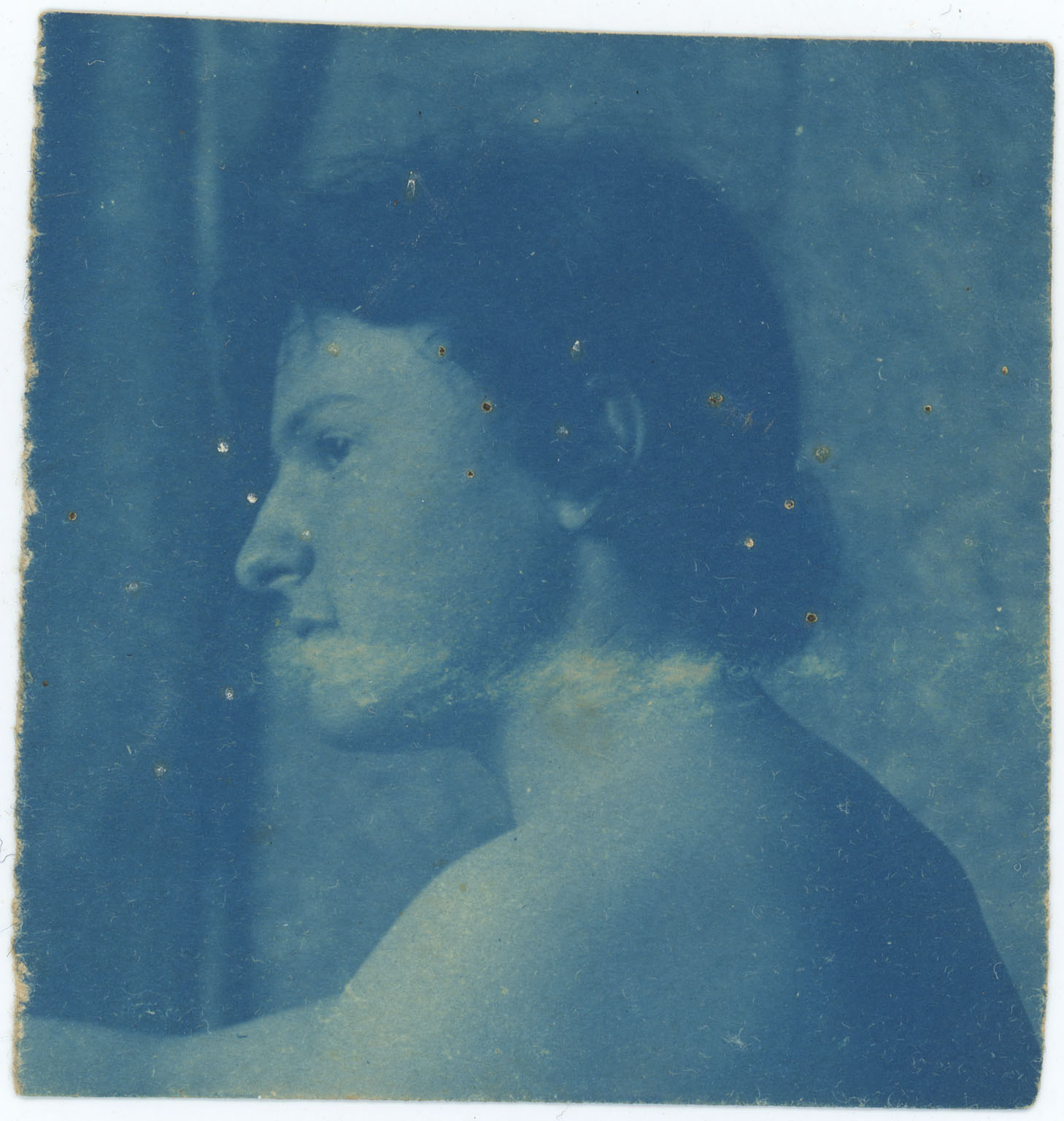 Female with bare shoulders, in profile