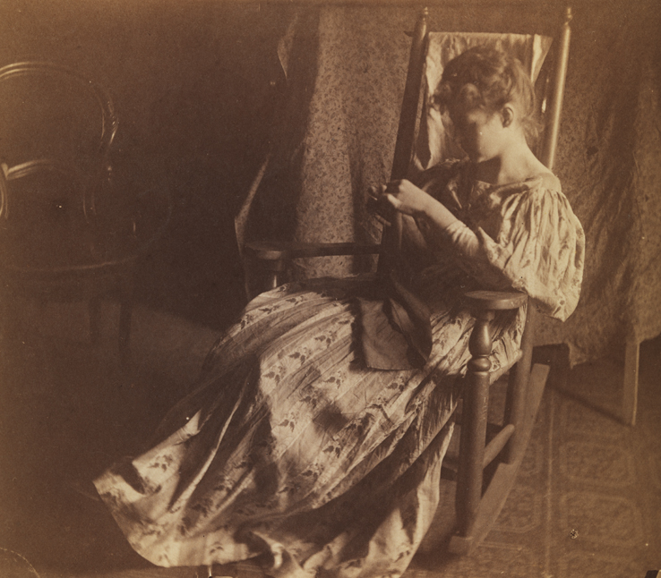 Woman sewing in rocking chair