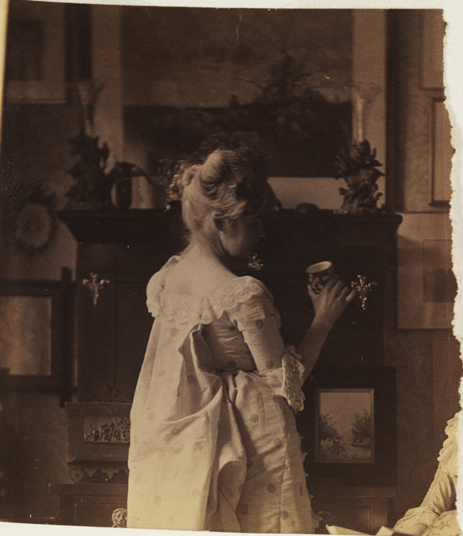 Woman in eighteenth-century costume, holding teacup