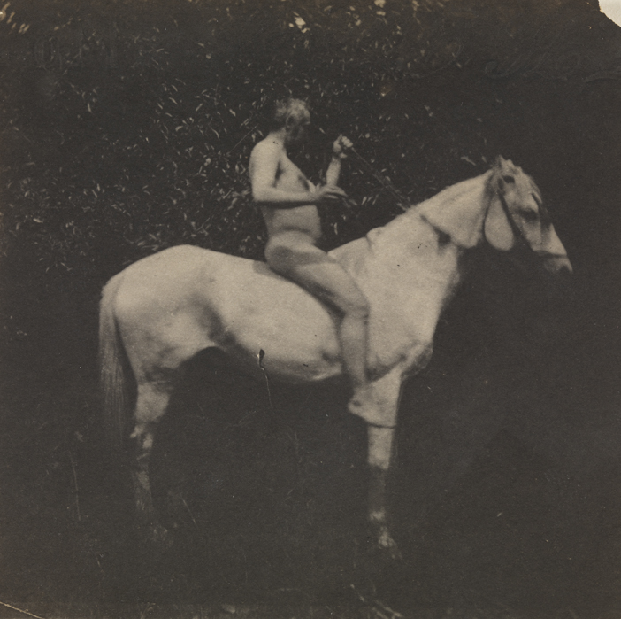 Thomas Eakins nude, facing right, on his horse Billy, both arms raised