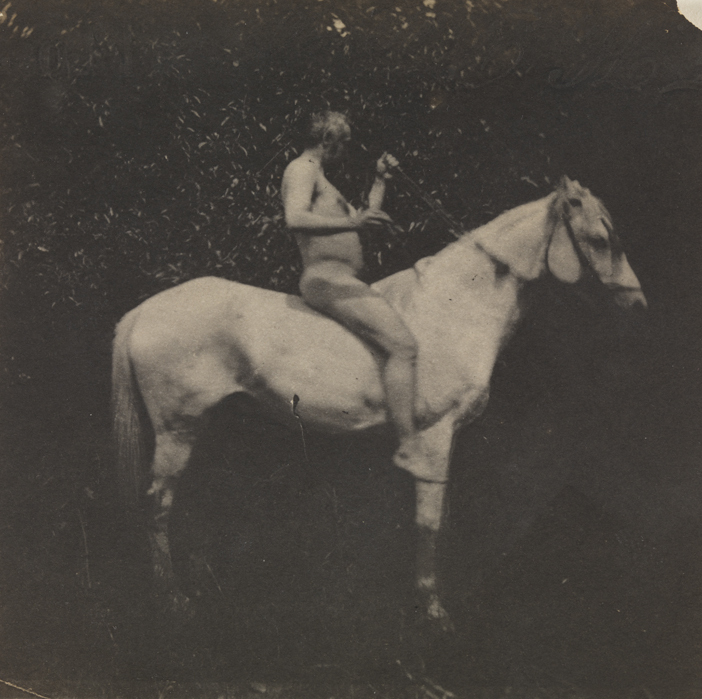 Thomas Eakins nude, facing right, on his horse Billy, both arms raised