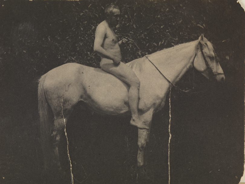 Thomas Eakins nude, facing right, on his horse Billy