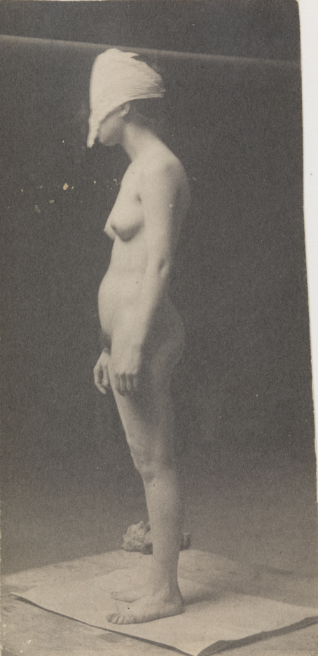 Female nude with mask, facing left