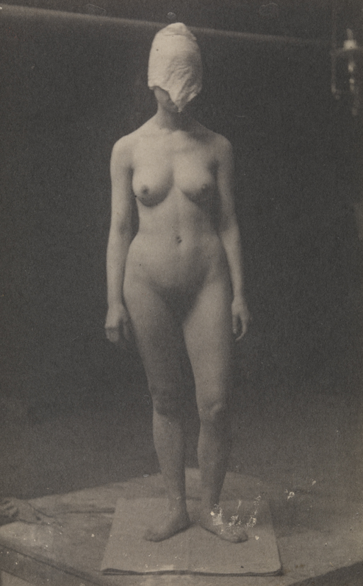 Female nude with mask, left leg bent