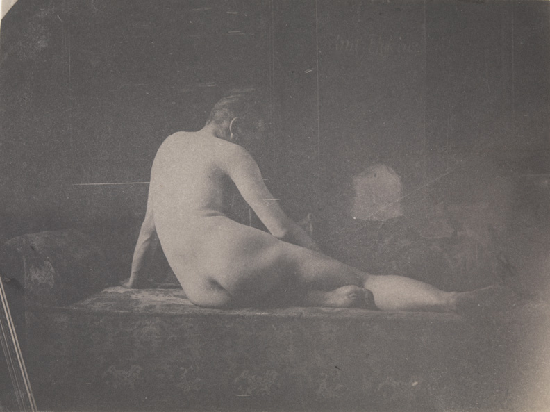 Thomas Eakins nude, semireclining on couch, from rear