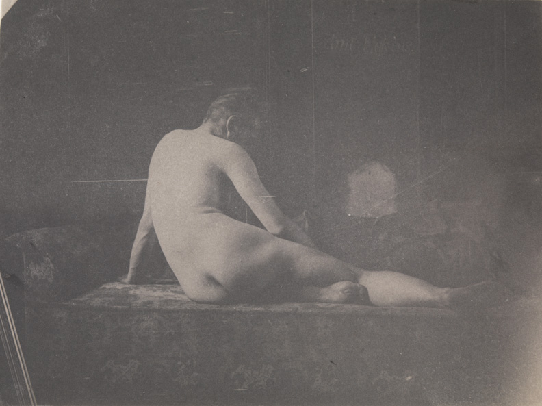 Thomas Eakins nude, semireclining on couch, from rear