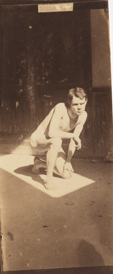 Male nude crouching in sunlit rectangle in Pennsylvania Academy studio