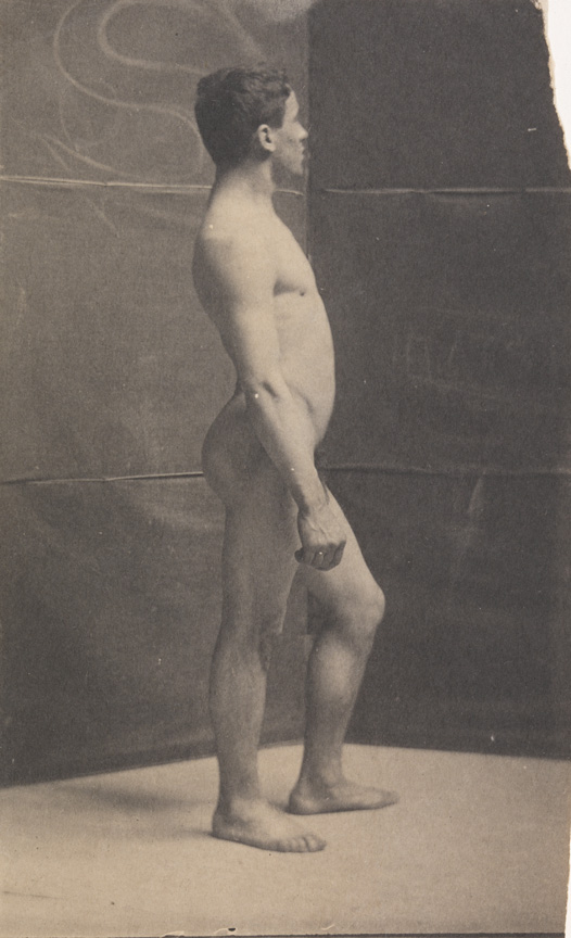 Tom Eagan nude, facing right, in front of folding screen