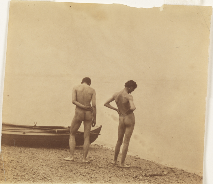 Thomas Eakins nude and J. Laurie Wallace nude, from rear, in front of boat at shoreline