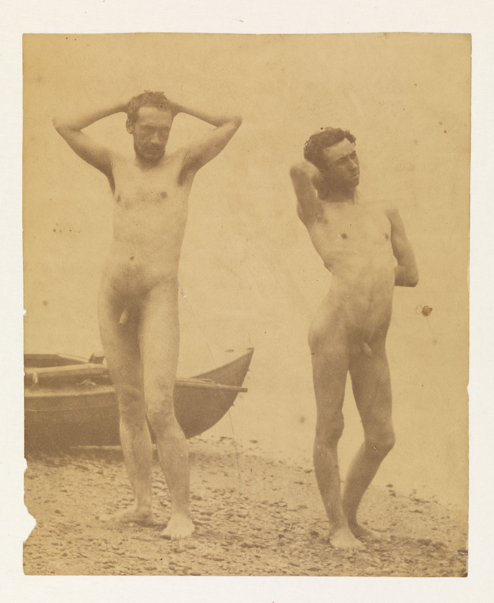 Thomas Eakins nude and J. Laurie Wallace nude in front of boat at shoreline