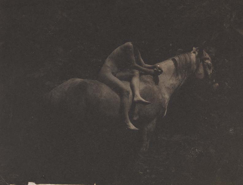 Susan Macdowell Eakins nude, sitting sidesaddle, hands clasped, on Thomas Eakins's horse Billy