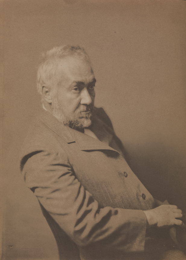 Eakins at about age sixty, sitting, looking right
