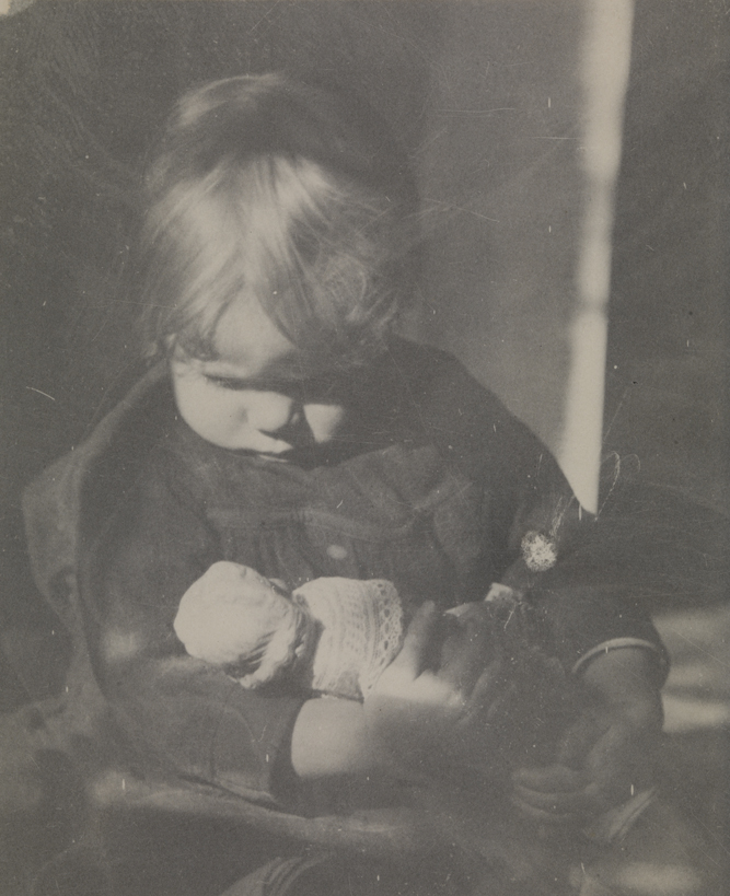 Betty Reynolds with doll on lap