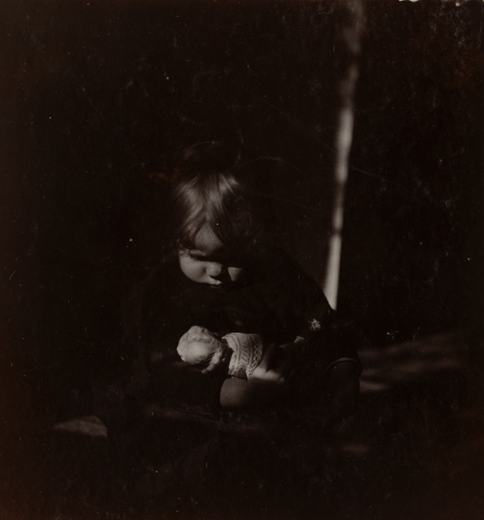 Betty Reynolds with doll on lap