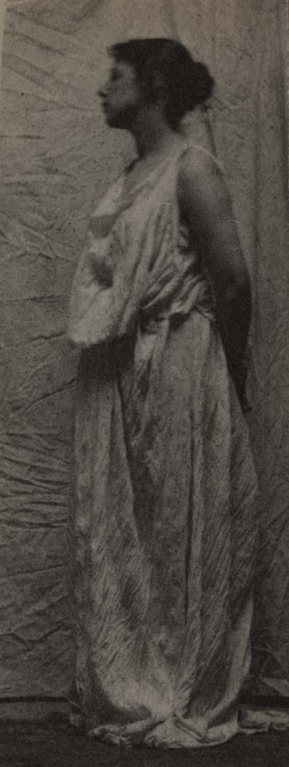 Weda Cook in classical costume, facing left