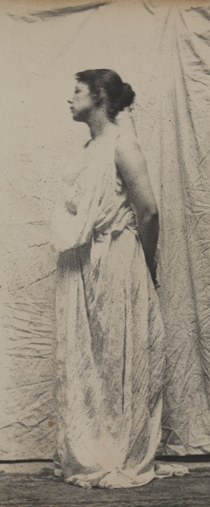 Weda Cook in classical costume, facing left