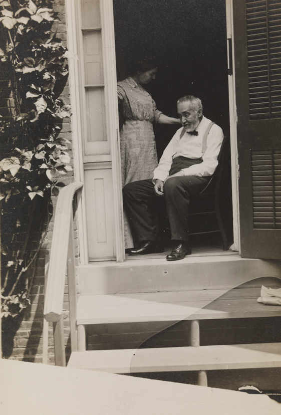 Thomas Eakins and Addie Williams in doorway of the family home at 1729 Mount Vernon Street, Philadelphia
