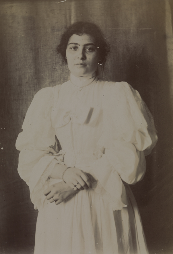 Unidentified young woman in light dress