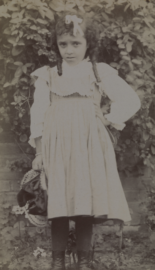 Unidentified young girl with long finger curls