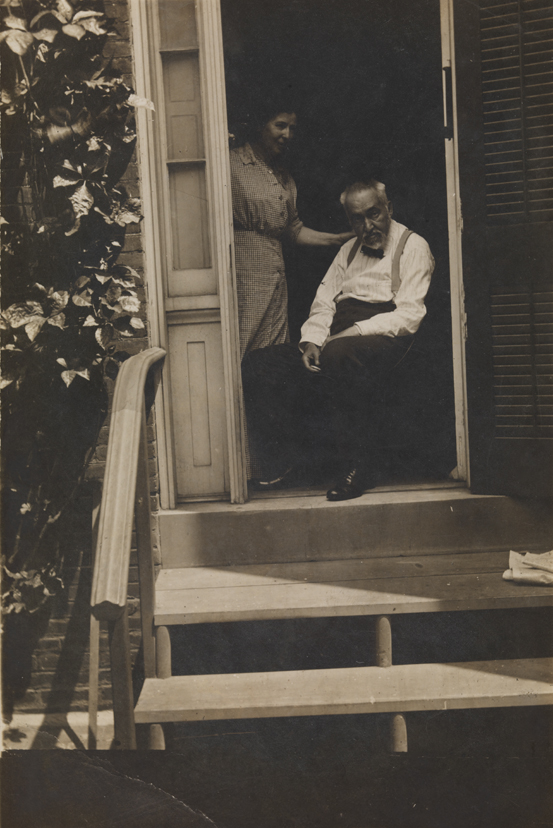 Thomas Eakins and Addie Williams in doorway of the family home at 1729 Mount Vernon Street, Philadelphia