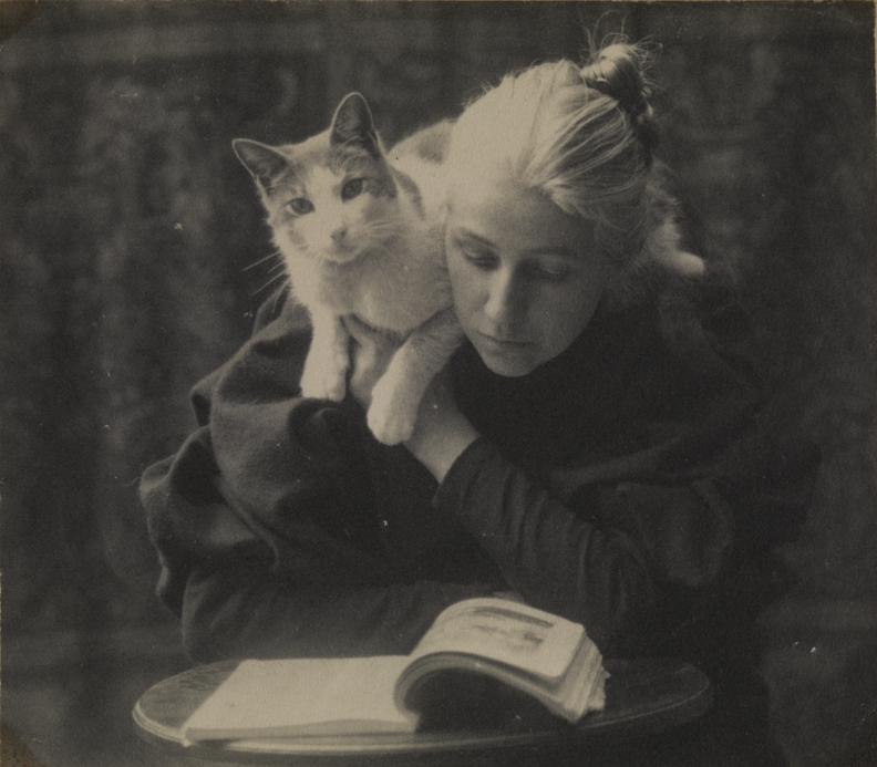 Amelia Van Buren sitting with cat on shoulder