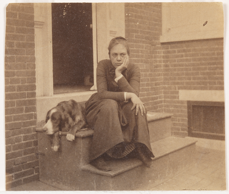 Margaret Eakins and Eakins' setter Harry on doorstep of the family home at 1729 Mount Vernon Street, Philadelphia