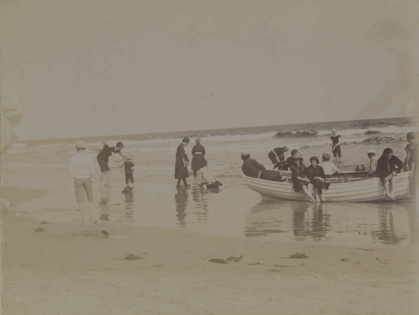 Unidentified figures on beach