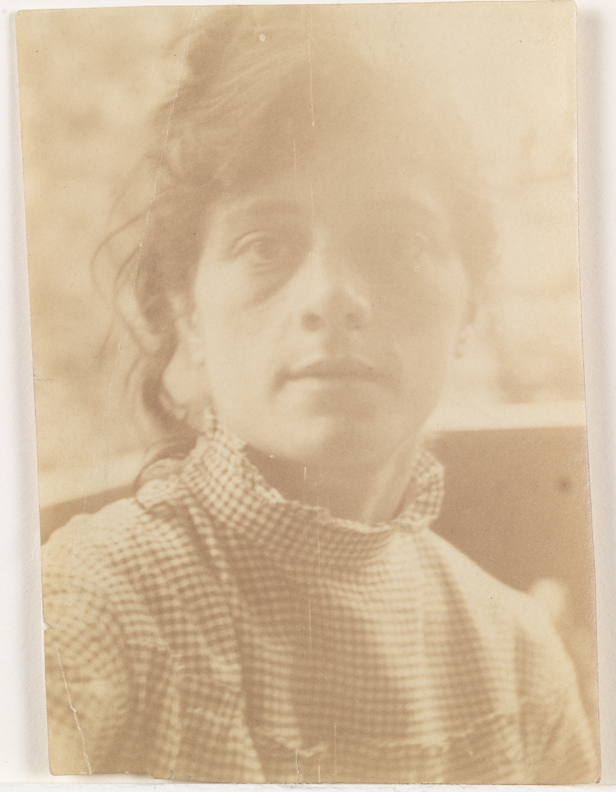 Self-portrait in a gingham dress